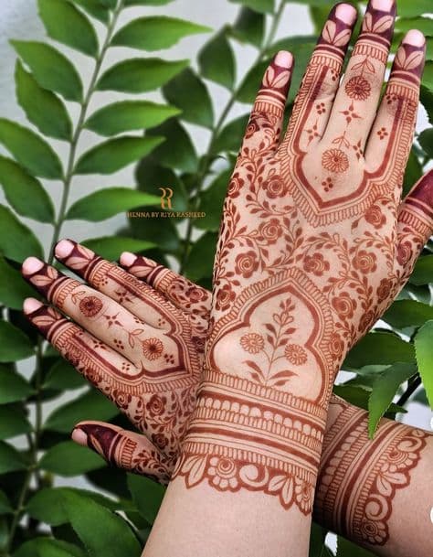 Floral Adornment: Intricate Henna Hands for a Haldi Blessing
