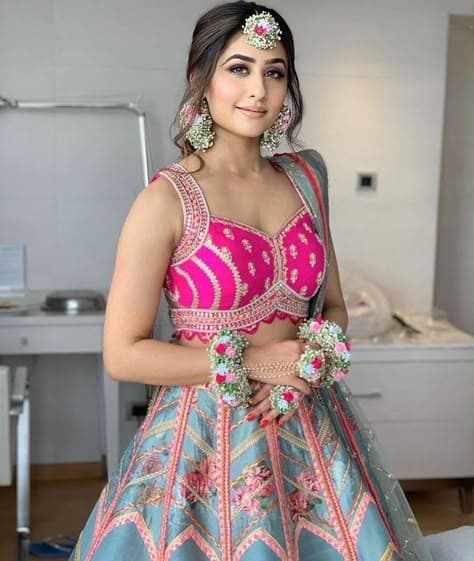 Haldi Hues: Radiant Pink & Serene Blue Lehenga for a Joyful Celebration