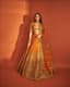 Gilded Sunset: An Orange Lehenga Radiating Bridal Warmth