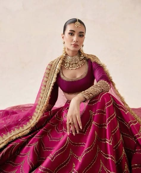 Magenta Majesty: Bridal Lehenga with Gilded Flourishes