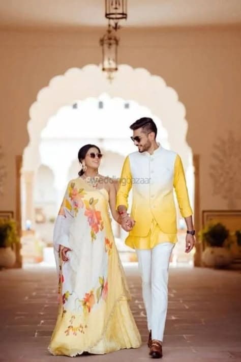 Golden Hour Promise: A Haldi Embrace Under the Ancient Arch