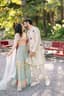 Sunlit Promise: A Haldi Kiss Amidst Verdant Gardens
