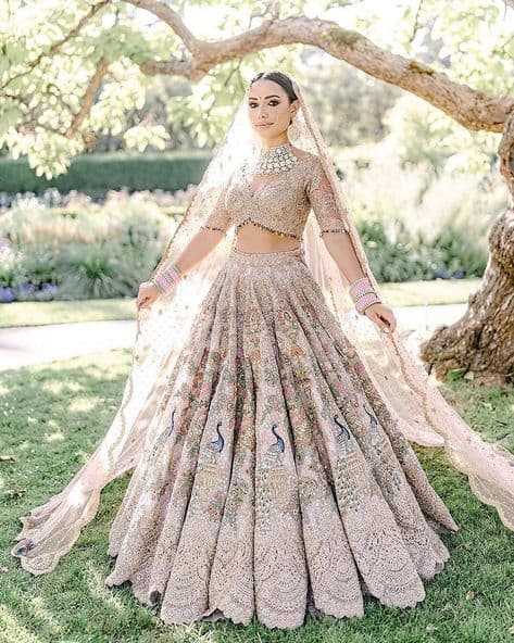 Whispers of Dawn: A Peacock's Promise Lehenga