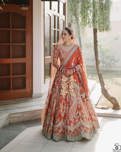 Sun-Kissed Ember: A Bridal Lehenga Woven with Dreams