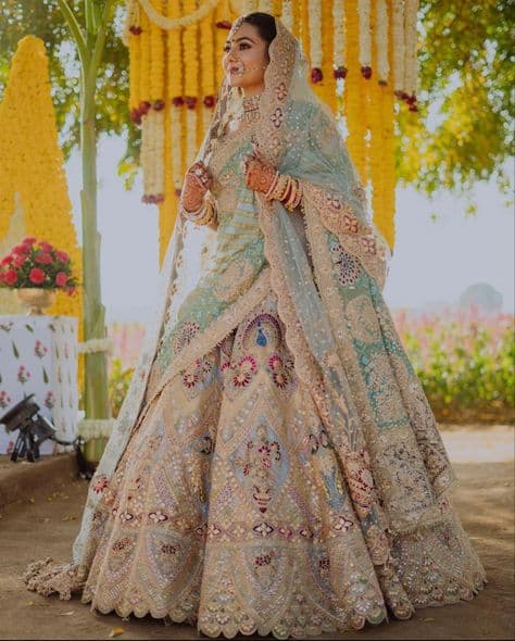 Serene Aqua Dream: Embroidered Bridal Lehenga in the Golden Hour