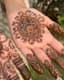 Haldi's Whisper: Intricate Mehndi Mandala on Sun-Kissed Skin