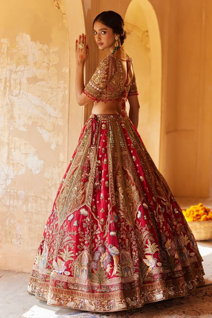 Crimson Pavilion: A Bridal Lehenga Whispering Ancient Tales