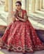 Crimson Bloom: A Regal Bridal Lehenga in Amber Light