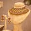 Gilded Heritage: A Bridal Coin Necklace and Jhumka Earring Set